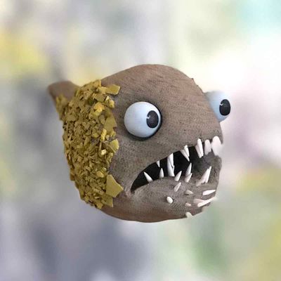 Rumpetroll, gul keramikk skulptur, henger fra taket